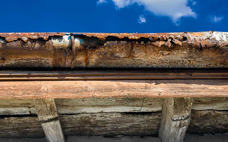 old-gutter-against-blue-sky